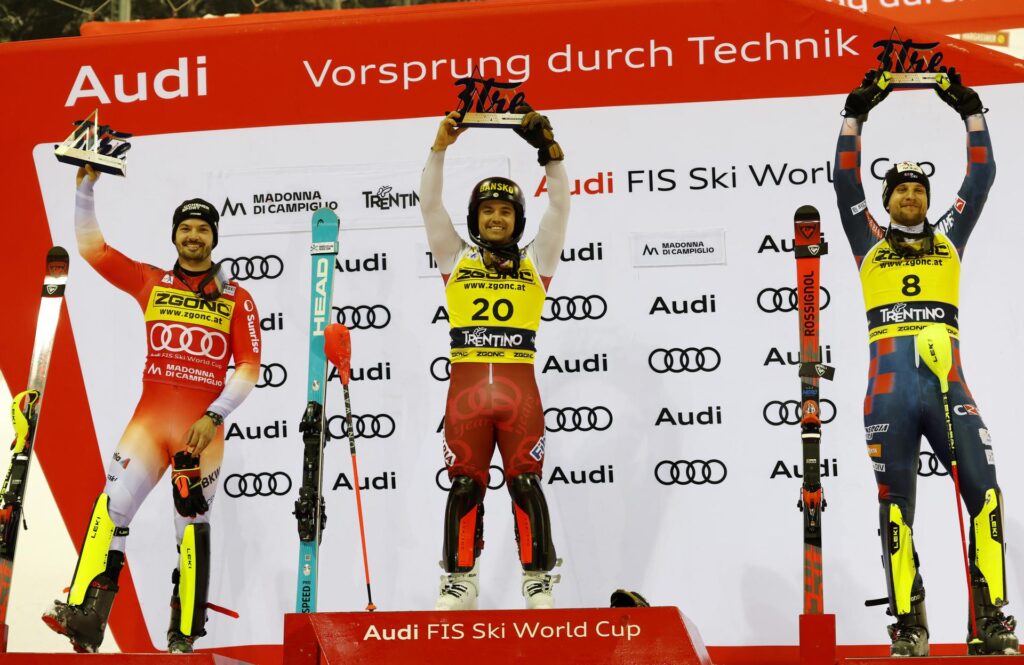 The podium of the 71st edition of the 3Tre with Loic Meillard (left), winner Albert Popov (center), and Samuel Kolega (Credits: Pentaphoto);